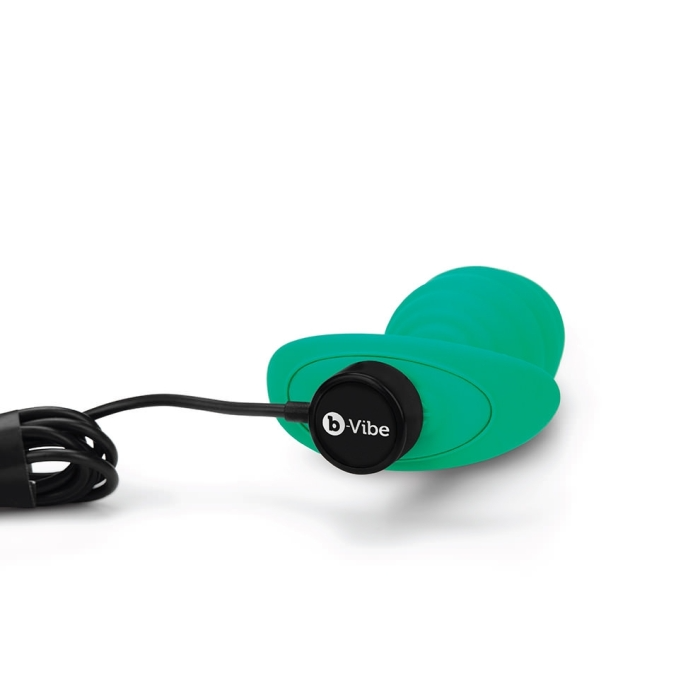 Green silicone anal plug with a twist texture and b-Vibe logo.