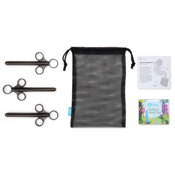 Three black lube applicators with a mesh bag and two guides.