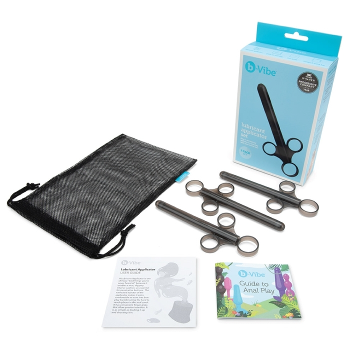 A b-Vibe lubricant applicator set with three applicators, a mesh bag, and guides.