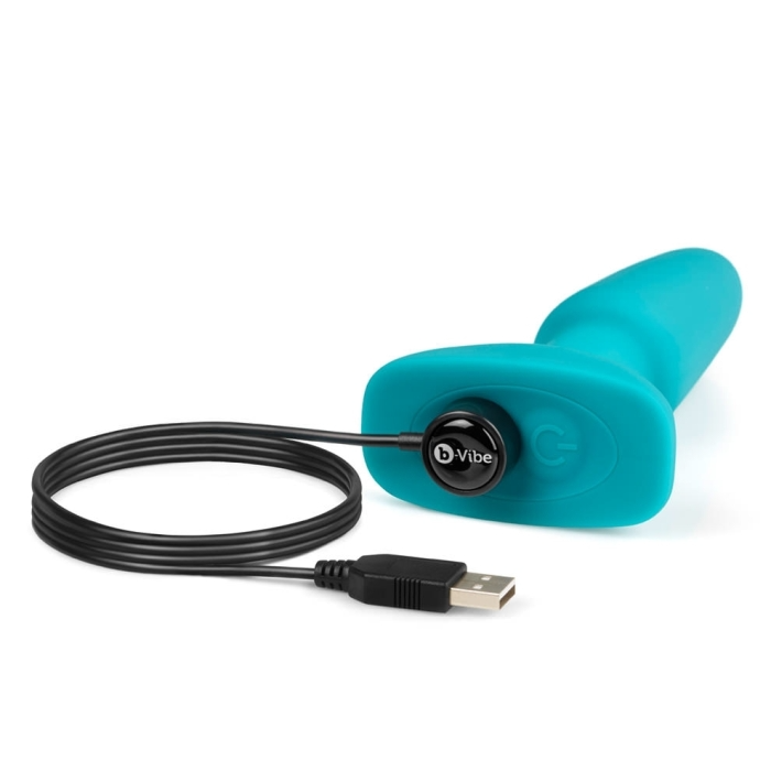 A teal b-Vibe anal toy with a black charging cable and USB plug.