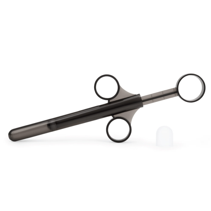 A dark grey anal training kit with finger loops and a white cap.