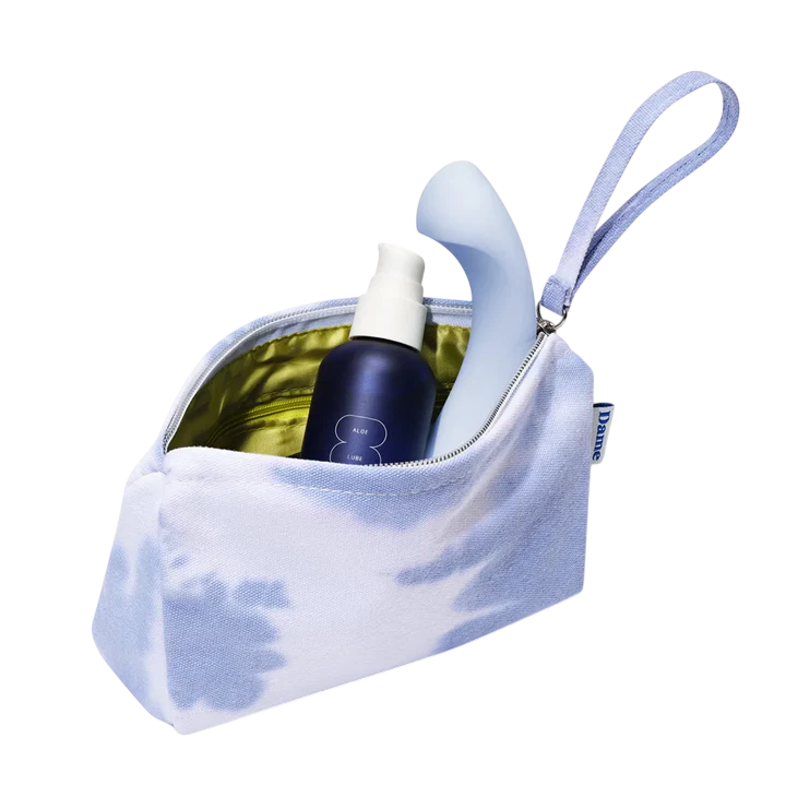 A light blue tie-dye pouch with a blue bottle of lube and a light blue vibrator inside.