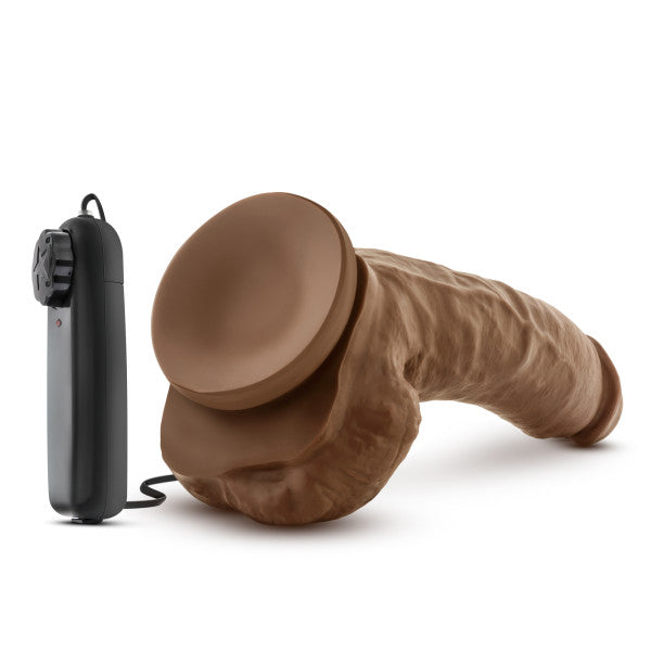 9-inch realistic vibrating dildo with suction cup base and black remote control.