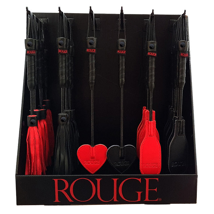 A black counter display unit holding 36 red and black mini crops and floggers.