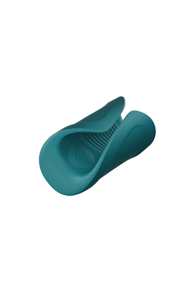 A teal silicone glans massager with textured inner surface.