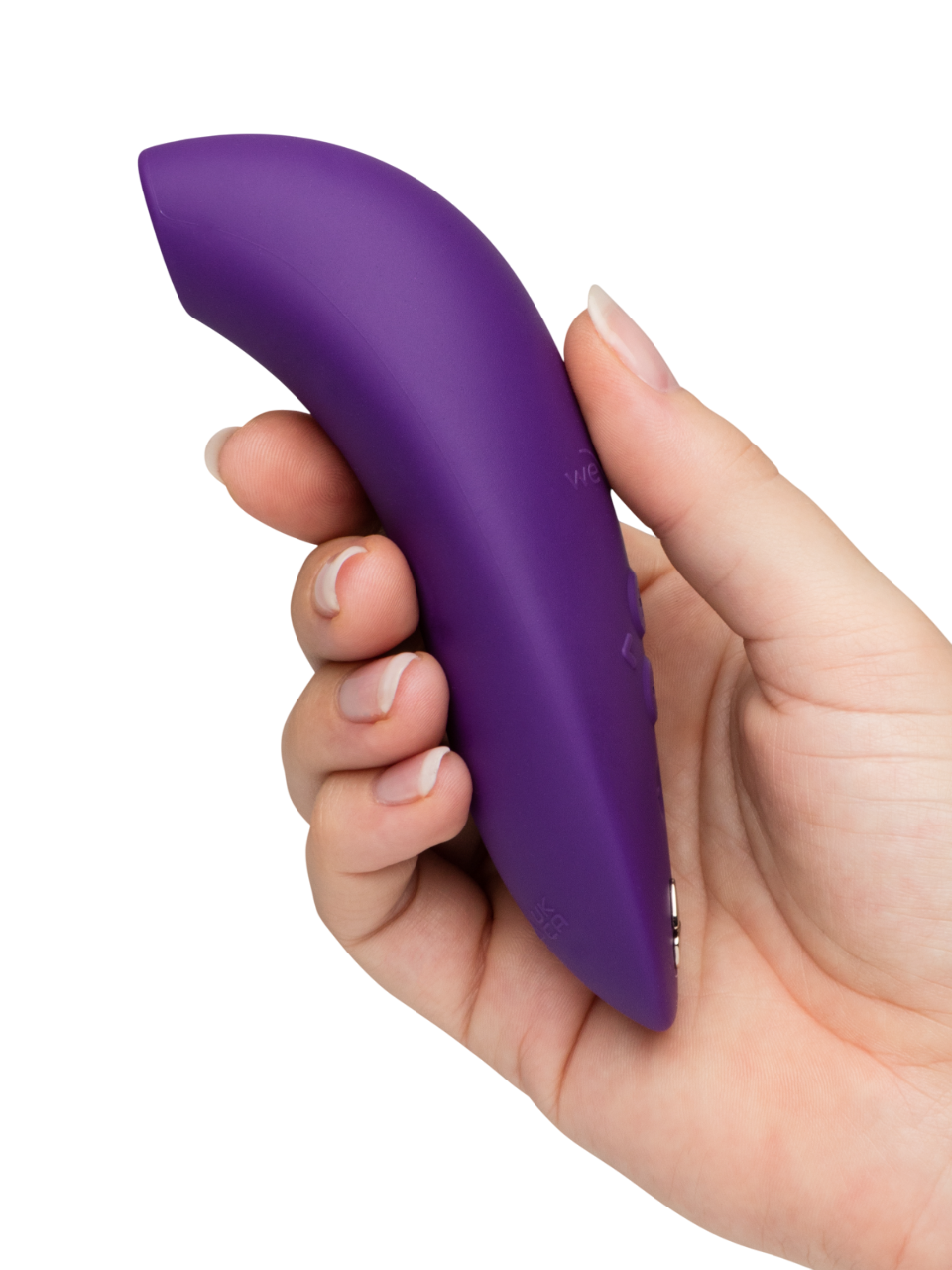 A hand holds a purple We-Vibe Melt 2 clitoral stimulator.