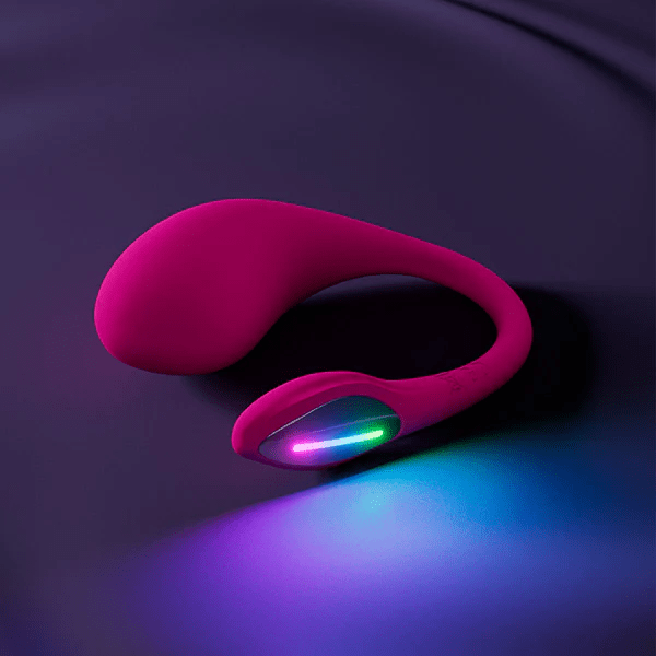 Pink app-controlled G-spot vibrator with a curved design and colorful LED light.