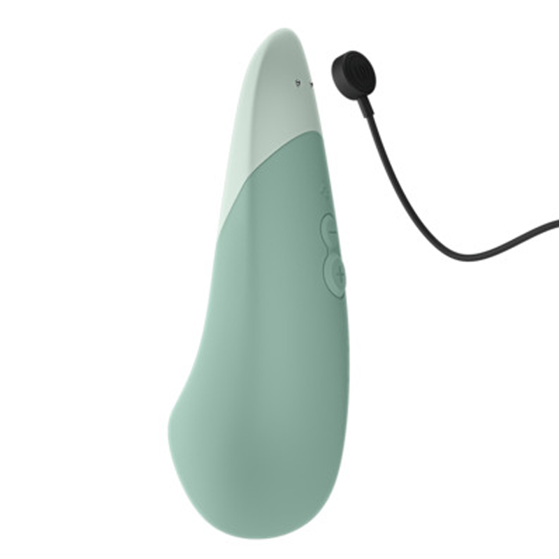 A teal and white clitoral vibrator with a charging cable.