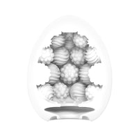 White egg-shaped masturbator with internal bumpy and ribbed textures.