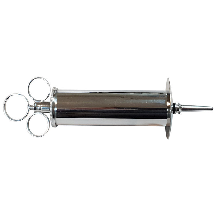 Stainless steel enema syringe with three finger loops and a pointed tip.