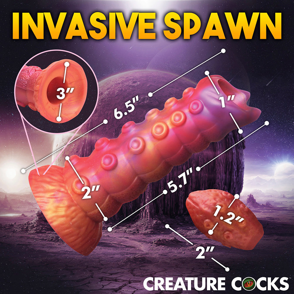 Silicone fantasy dildo with segmented ribs and alien-inspired design.
