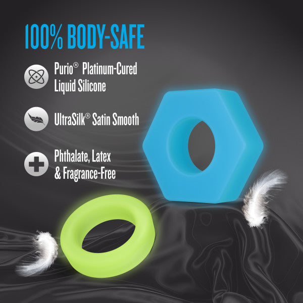 Two glow-in-the-dark silicone rings, one blue hexagonal and one green circular.