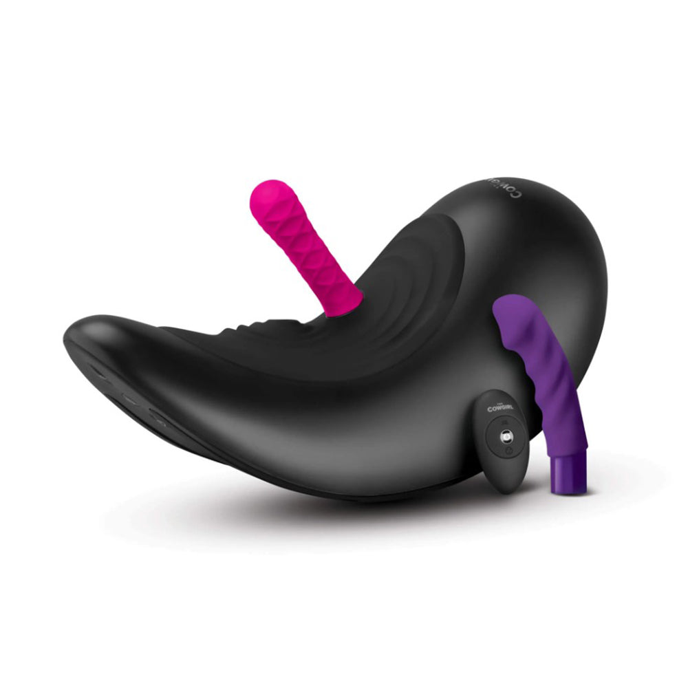 Black Cowgirl Saddle sex machine with pink and purple attachments and a remote.