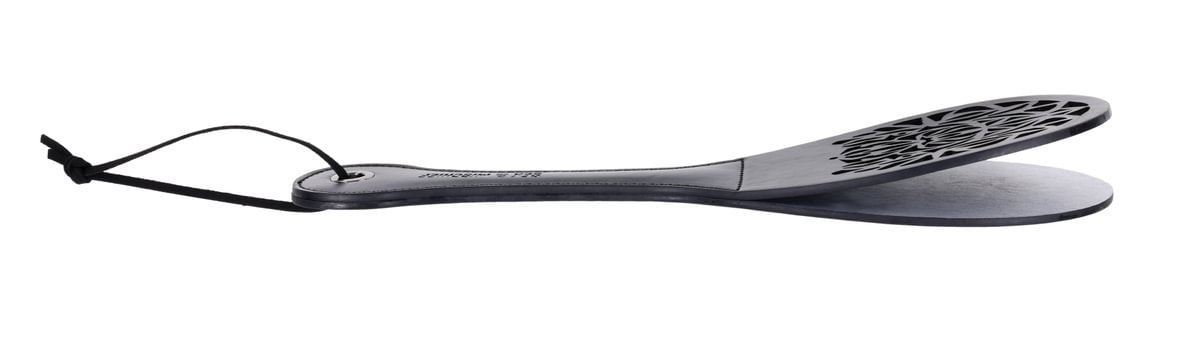 Faux leather spanker paddle with a split tip and lace cutout.