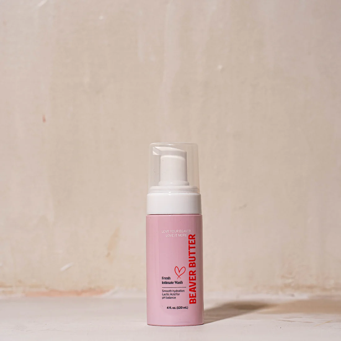 A pink bottle of Beaver Butter Fresh Intimate Wash with a white pump.
