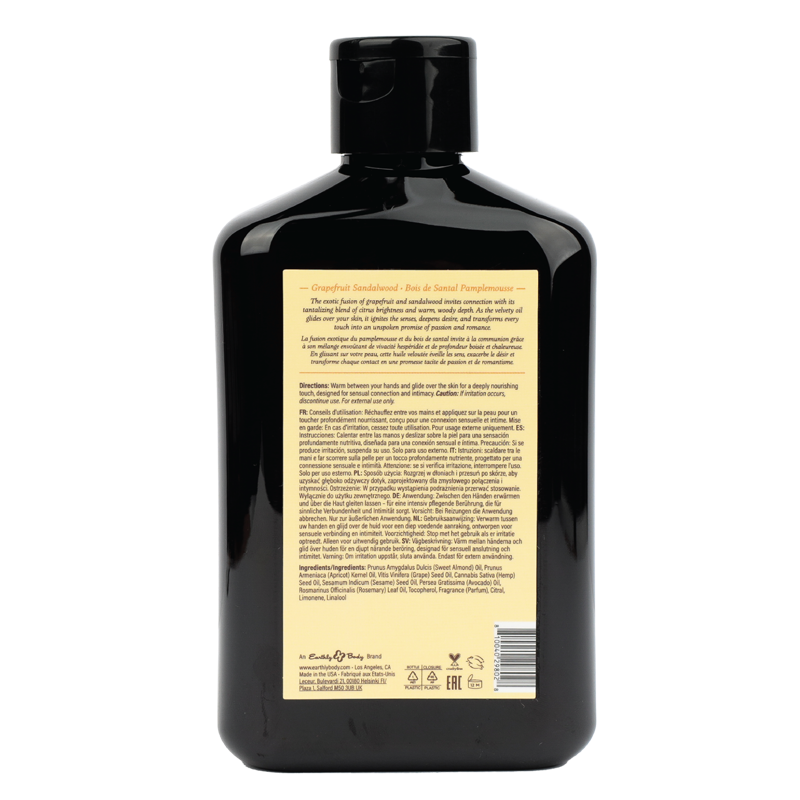 Bottle of Grapefruit Sandalwood massage oil with black cap and label.