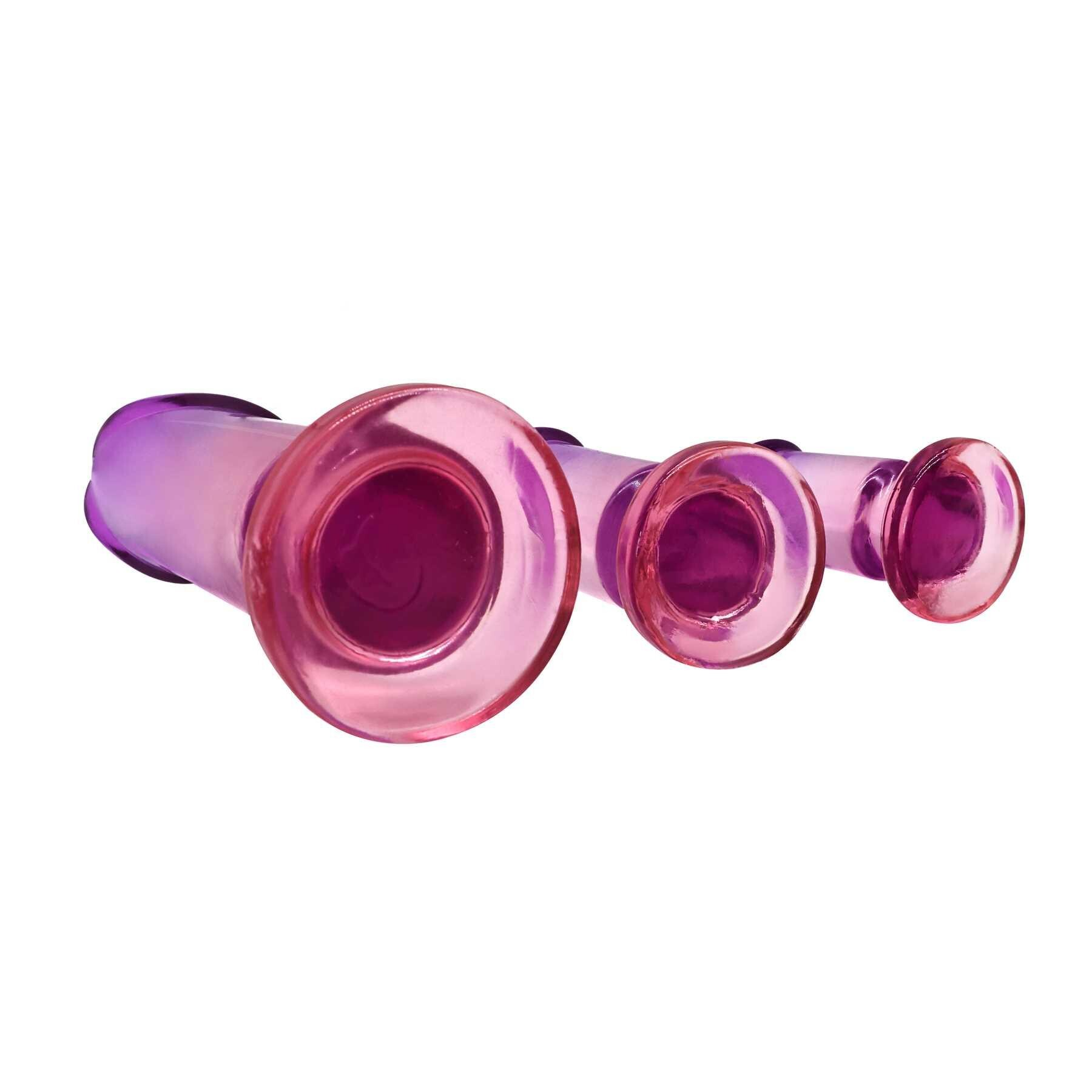 Three graduated pink and purple anal plugs made of TPE.