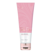 A pink tube of Tush Ease Anal Relaxant Gel with a rose gold cap.