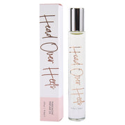 A bottle and box of Head Over Heels Pheromone Perfume Oil.