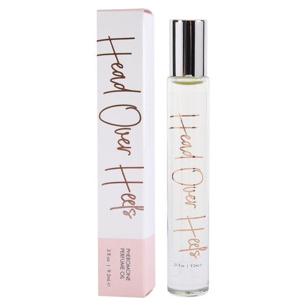 A bottle and box of Head Over Heels Pheromone Perfume Oil.