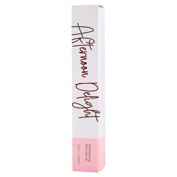 A white box with "Afternoon Delight" in cursive and "Pheromone Perfume Oil" at the bottom.
