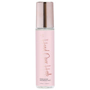 A pink bottle of Head Over Heels Pheromone Fragrance Mist.