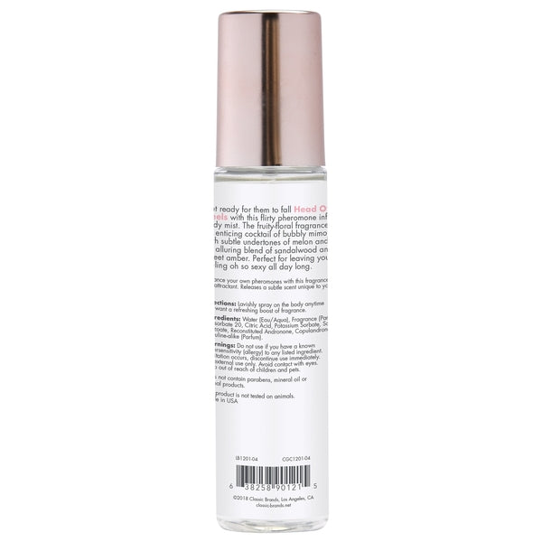 Head Over Heels Pheromone Body Mist with a rose gold cap.