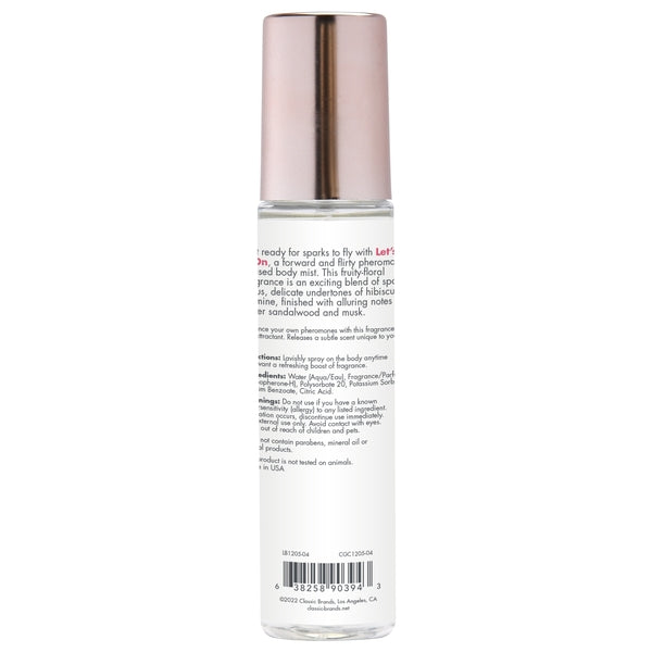 A clear bottle of pheromone infused body mist with a rose gold cap.