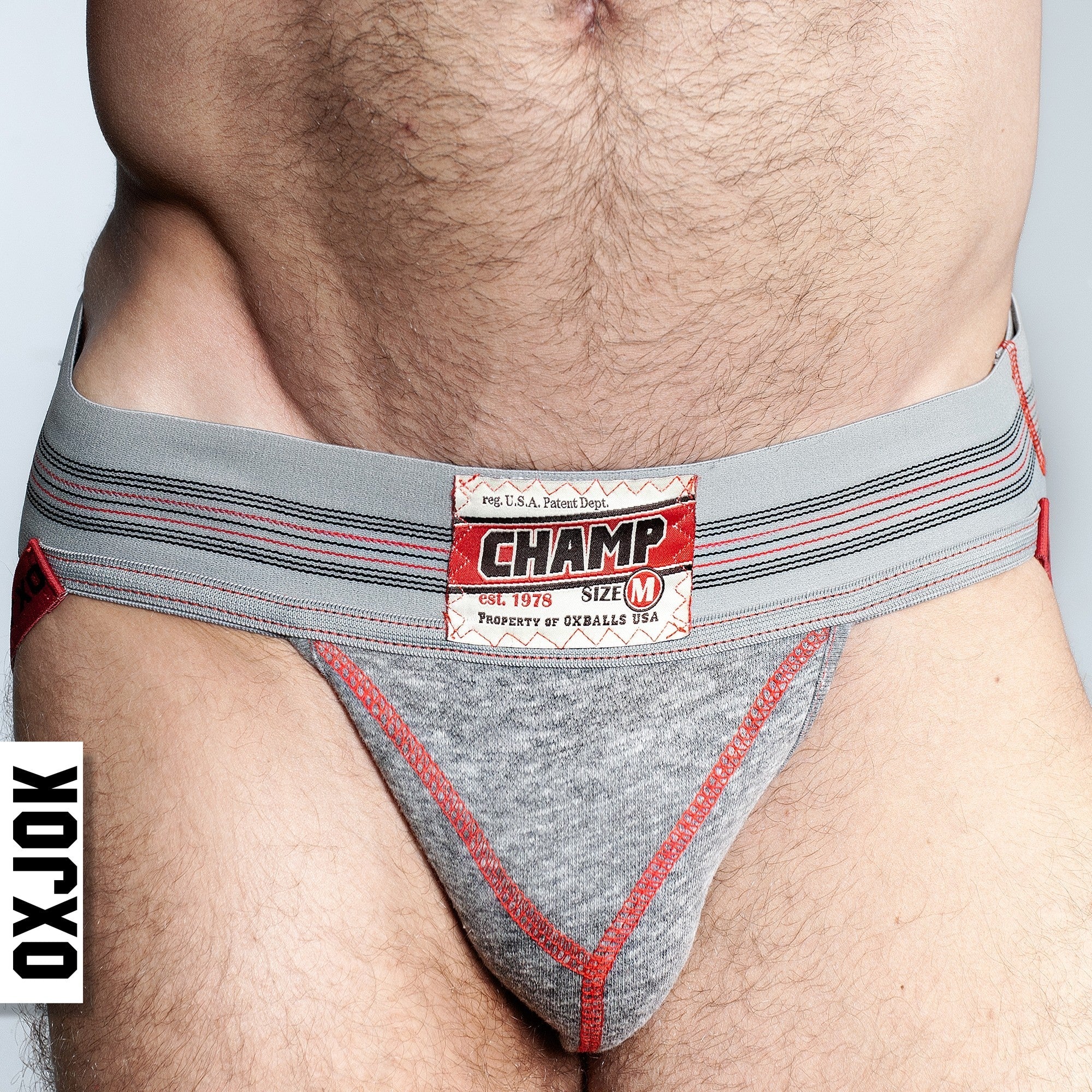 Gray heather jockstrap with vintage label and red trim.