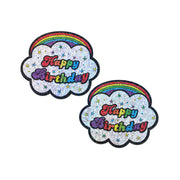 Two glittery cloud-shaped pasties with rainbow arcs and "Happy Birthday" text.