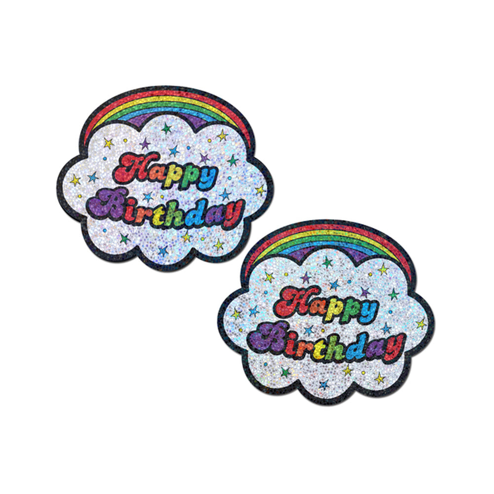 Two glittery cloud-shaped pasties with rainbow arcs and "Happy Birthday" text.