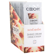 Coochy Sweet Nectar shave cream foil packets in a display box.