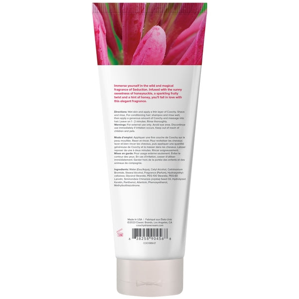 A white tube of Coochy Seduction moisturizing shave cream with pink floral accents.