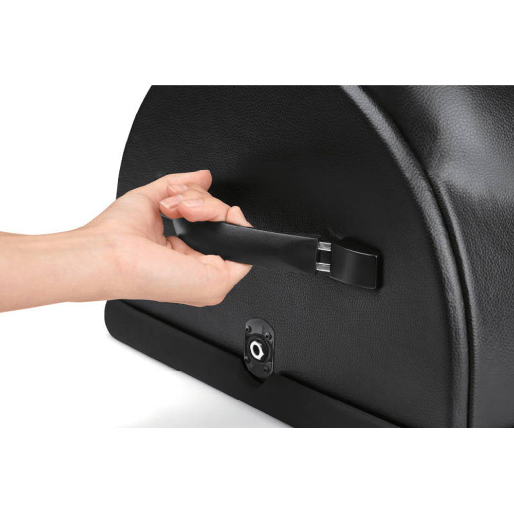 A hand grips a black handle on a textured black riding machine.