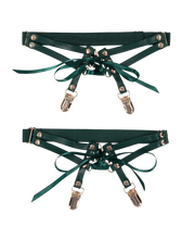 Emerald faux leather garters with satin laces and silver clips.