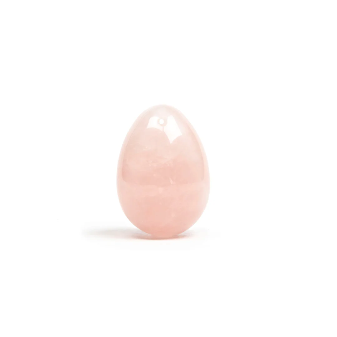 A pink crystal egg with a hole at the top.