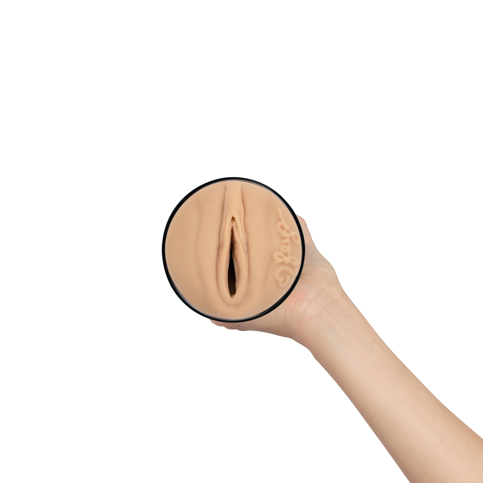 A hand holds a realistic TPE masturbator sleeve with a textured interior.