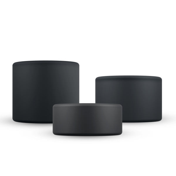 Three black silicone cock rings of varying sizes.