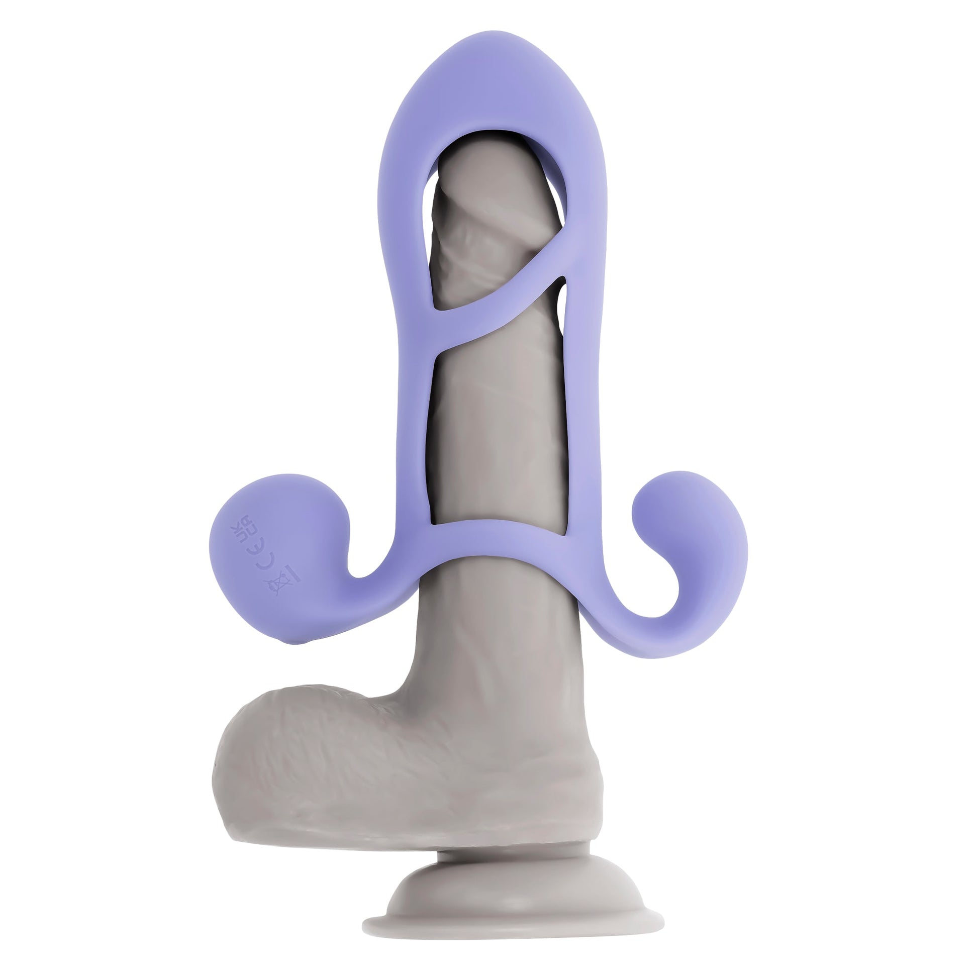 A grey silicone penis enhancer cage with a purple harness and suction cup base.