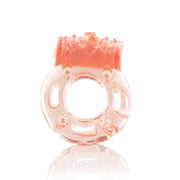 A pink vibrating cock ring with textured bumps on top.
