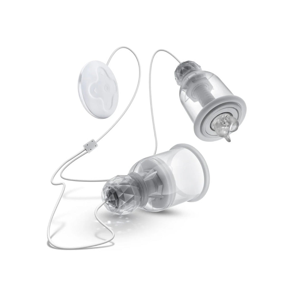 Two clear nipple massagers with a remote control.