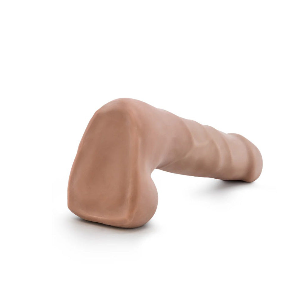 A 7-inch flexible dual-density dildo in blush color with a soft outer layer and firm core.
