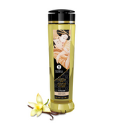 Shunga Vanilla Desire massage oil bottle with a vanilla flower and pods.