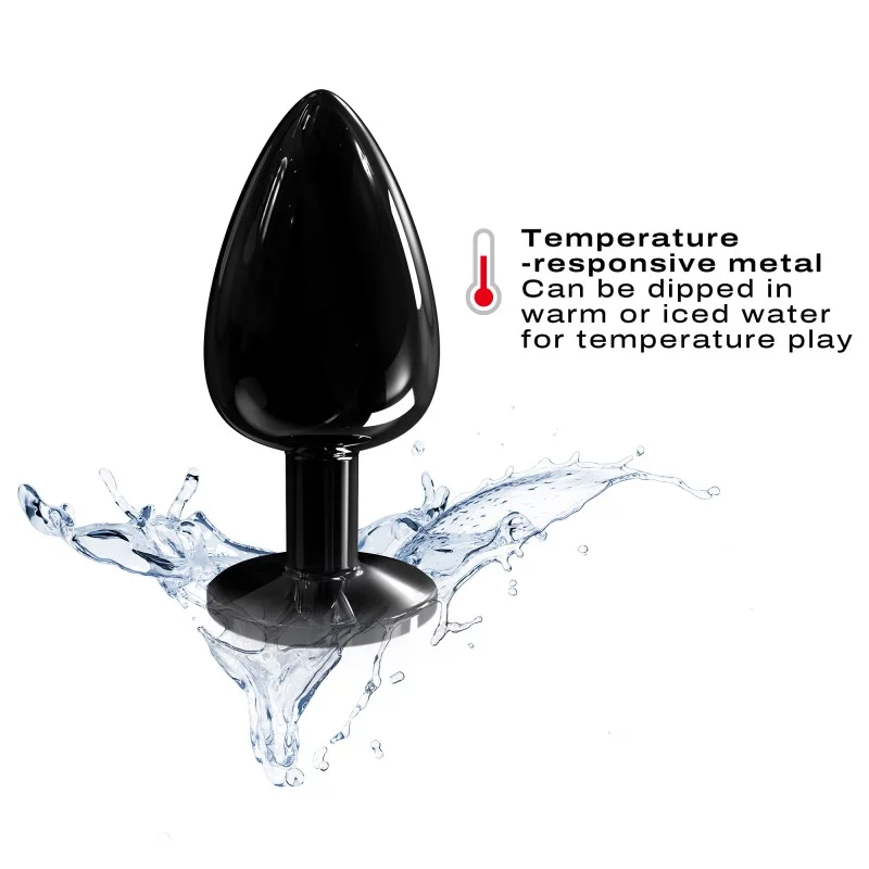 Black metal anal plug with a diamond base, shown with water splashes.