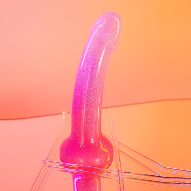 Pink glitter silicone dildo with a curved shape and suction base.
