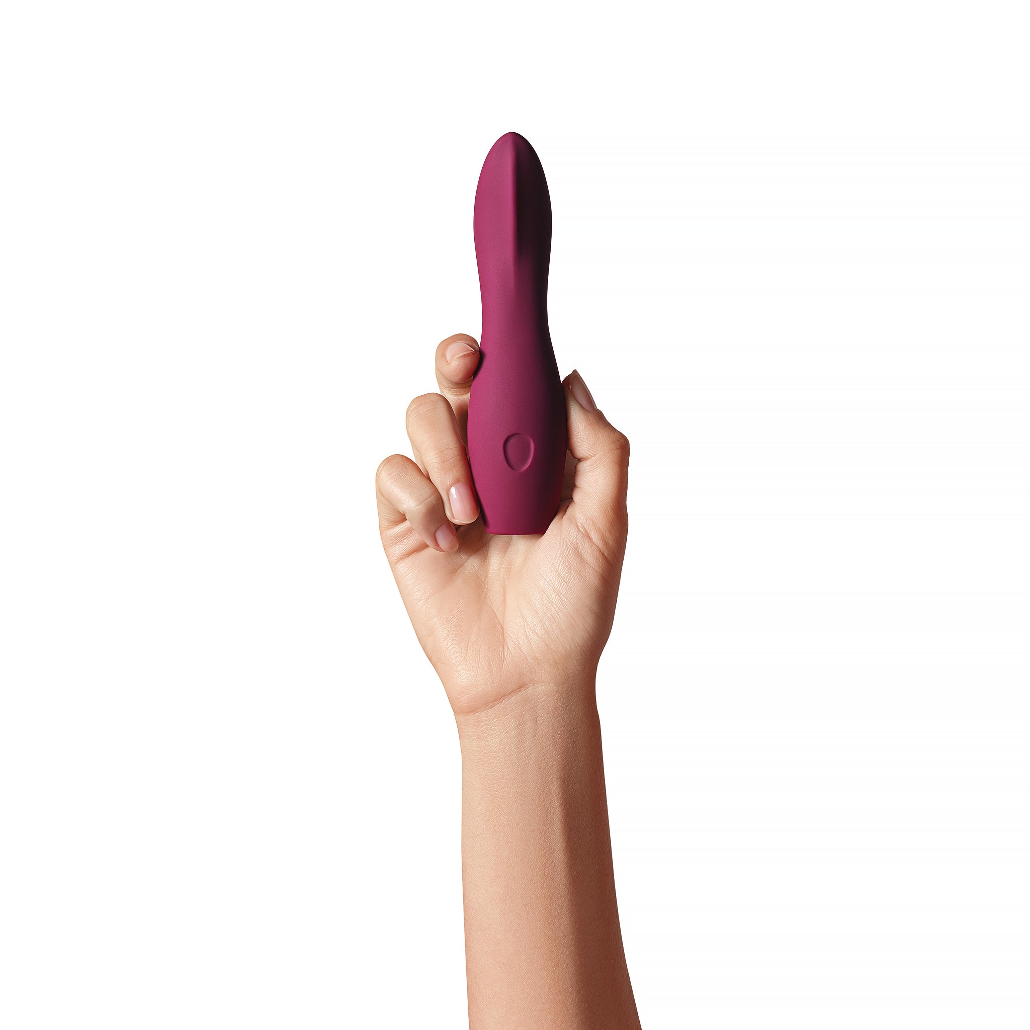 A plum-colored vibrator held in a hand.