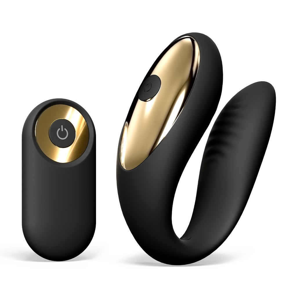 Black dual motor vibrator with gold accents and a remote control.