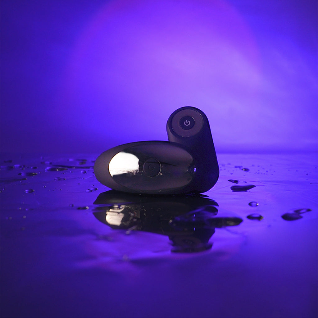A dual motor vibrator with a smooth, egg-shaped body and a curved top with a power button.