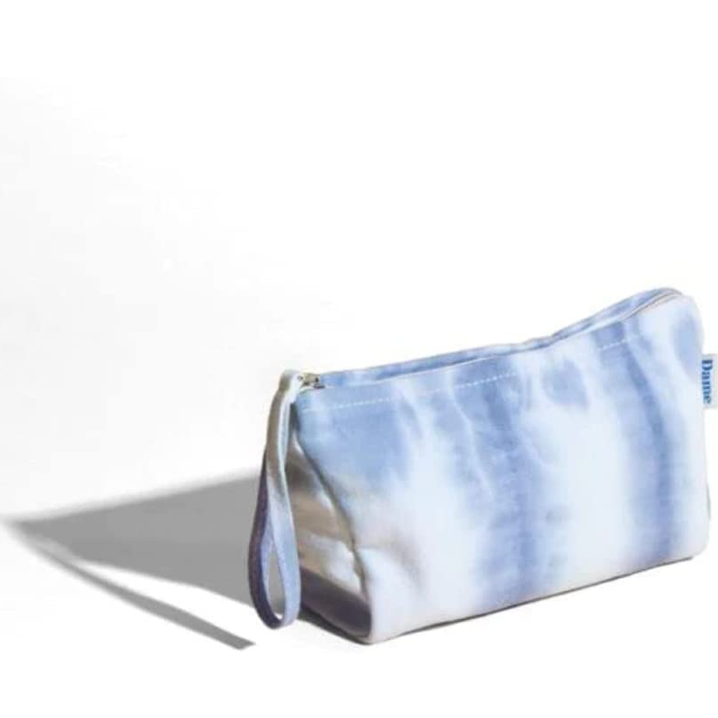 A blue and white tie-dye zippered pouch with a handle.