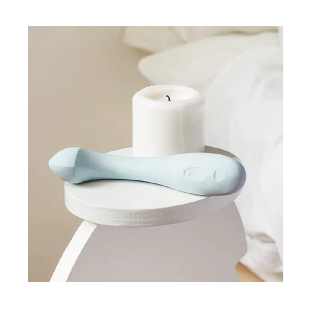 Pale blue silicone G-spot vibrator with a curved handle.